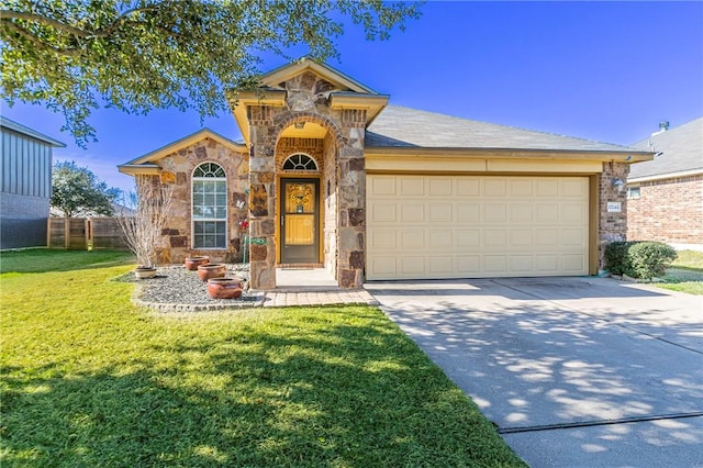 view of front of house with a garage and a front yard