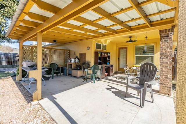 view of patio featuring ceiling fan