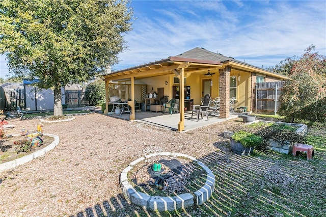 back of house featuring ceiling fan and a patio