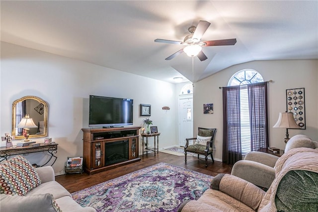 living room featuring ceiling fan, lofted ceiling, and dark hardwood / wood-style floors