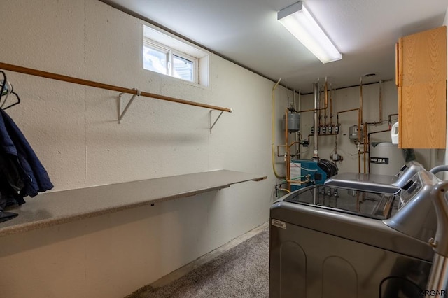 laundry room featuring water heater, independent washer and dryer, and carpet