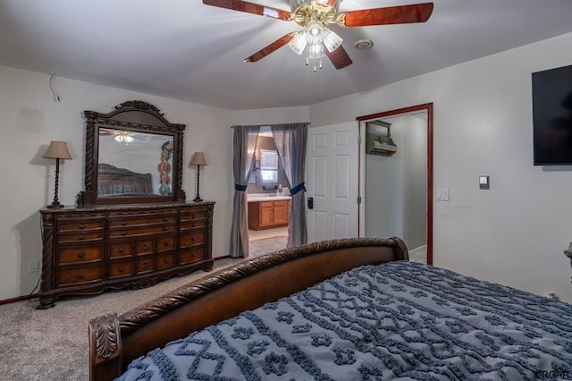 carpeted bedroom featuring ceiling fan and connected bathroom