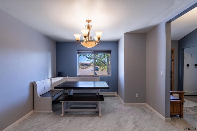 dining room featuring an inviting chandelier, breakfast area, and a baseboard heating unit