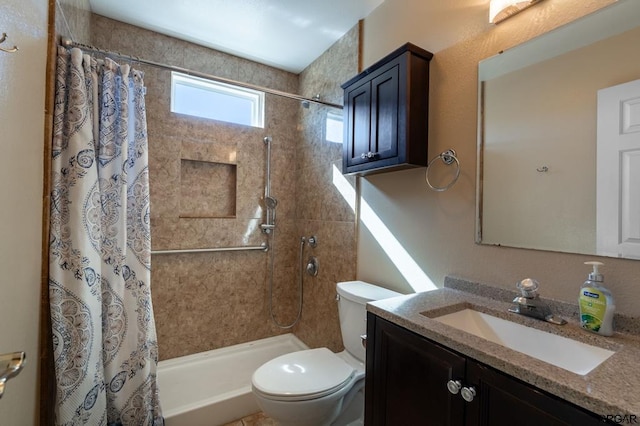 bathroom with vanity, toilet, and a shower with curtain