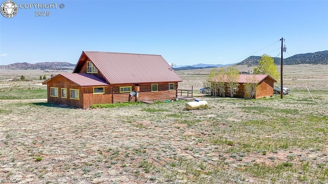 1660 Lone Tree Cir, Westcliffe, CO 81252 - back of property with a mountain view and metal roof