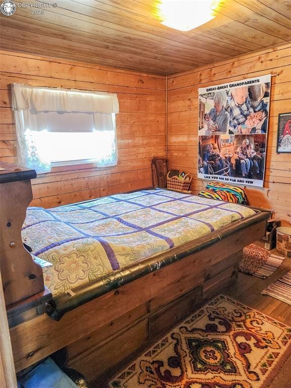 1660 Lone Tree Cir, Westcliffe, CO 81252 - bedroom featuring wooden walls, wooden ceiling, and wood finished floors