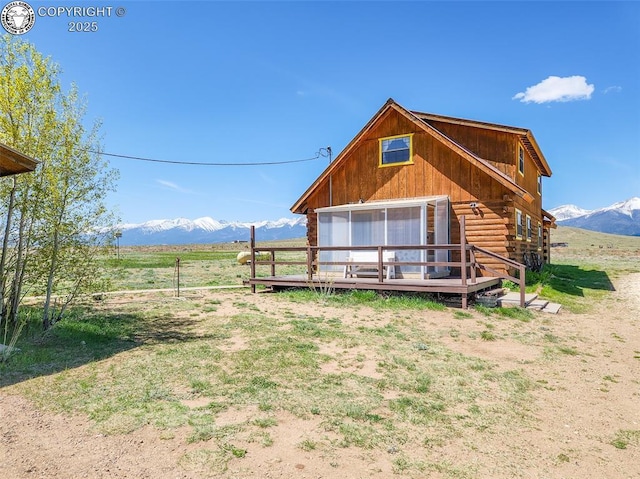 1660 Lone Tree Cir, Westcliffe, CO 81252 - back of property featuring a deck with mountain view, a view of rural / pastoral area, and log siding