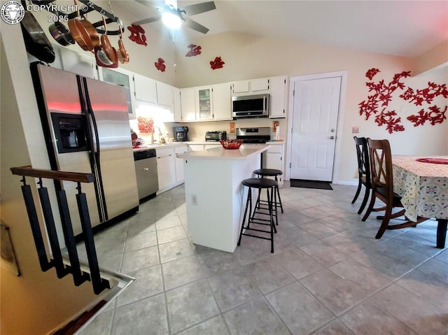 2114 Rangeview Dr, Pueblo, CO 81008 - kitchen with appliances with stainless steel finishes, ceiling fan, light countertops, a center island, and white cabinetry