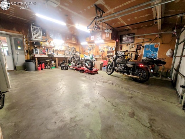 2114 Rangeview Dr, Pueblo, CO 81008 - garage with a workshop area and a garage door opener