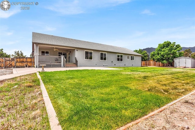 121 Mourning Dove Dr, Canon City, CO 81212 - rear view of property with a shed, a ceiling fan, stucco siding, a patio, and a mountain view