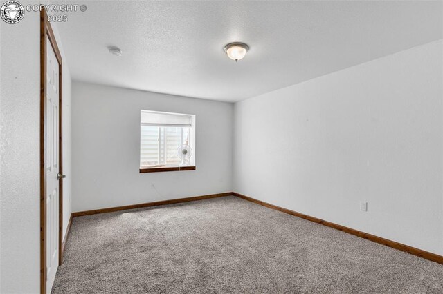 121 Mourning Dove Dr, Canon City, CO 81212 - carpeted empty room with a smoke detector and baseboards