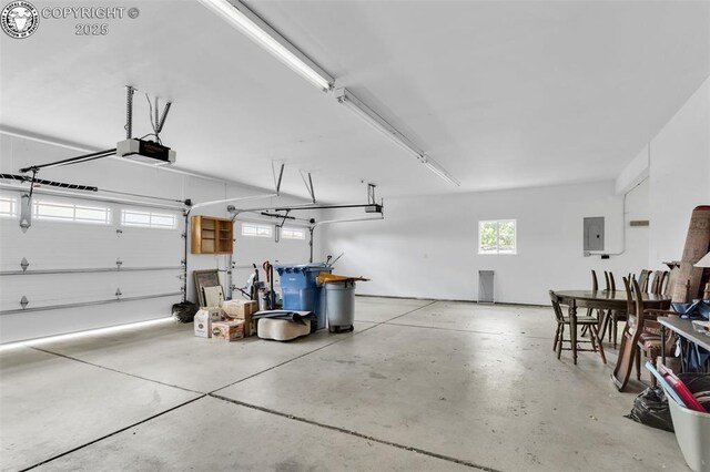 121 Mourning Dove Dr, Canon City, CO 81212 - garage with electric panel and a garage door opener