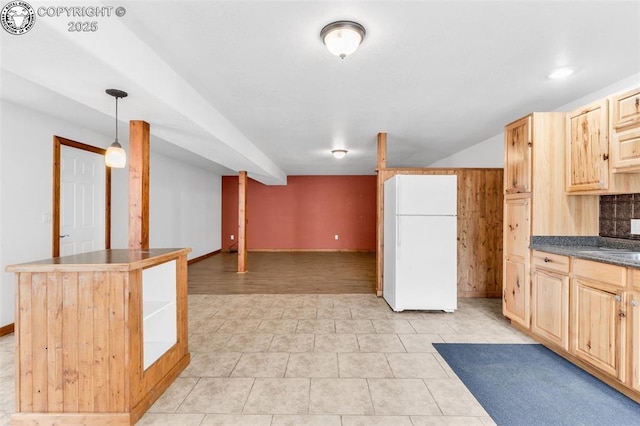121 Mourning Dove Dr, Canon City, CO 81212 - kitchen featuring freestanding refrigerator, light brown cabinets, dark countertops, decorative backsplash, and open floor plan
