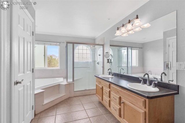 121 Mourning Dove Dr, Canon City, CO 81212 - bathroom with a bath, double vanity, tile patterned flooring, a shower stall, and crown molding