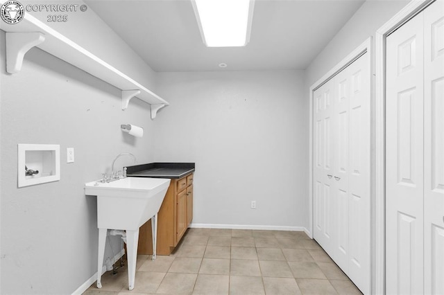 121 Mourning Dove Dr, Canon City, CO 81212 - laundry room featuring washer hookup and light tile patterned flooring