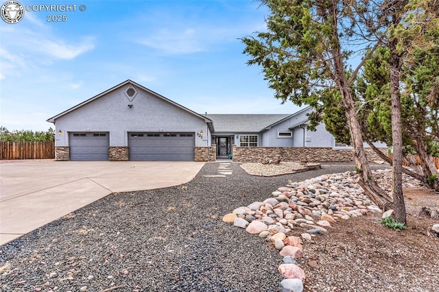 121 Mourning Dove Dr, Canon City, CO 81212 - ranch-style house featuring stone siding, an attached garage, driveway, and stucco siding
