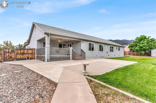 121 Mourning Dove Dr, Canon City, CO 81212 - back of house featuring a gate, stucco siding, and a patio
