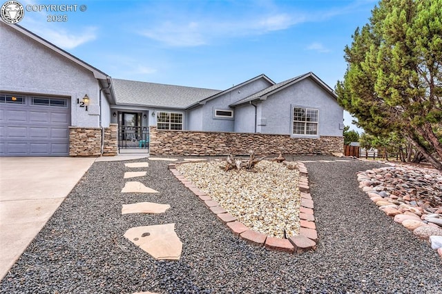 121 Mourning Dove Dr, Canon City, CO 81212 - ranch-style house featuring stucco siding, stone siding, concrete driveway, and a garage