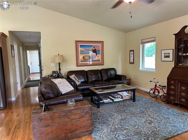 601 Petroleum Ave, Florence, CO 81226 - living area featuring lofted ceiling, wood finished floors, a ceiling fan, and baseboards