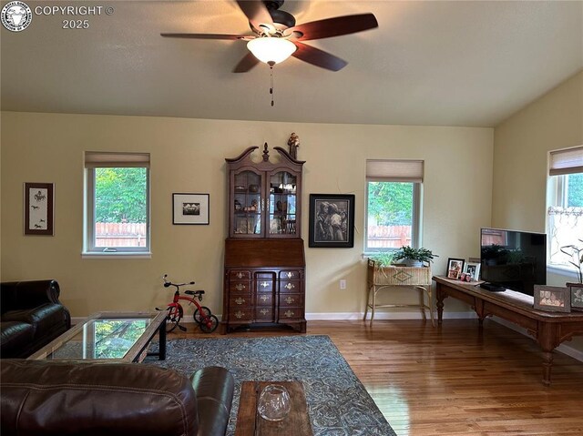 601 Petroleum Ave, Florence, CO 81226 - living area with healthy amount of natural light, wood finished floors, a ceiling fan, and baseboards