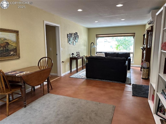 601 Petroleum Ave, Florence, CO 81226 - living area featuring a textured wall, recessed lighting, and an AC wall unit