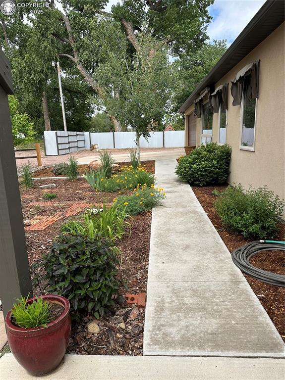 601 Petroleum Ave, Florence, CO 81226 - view of yard with an attached garage