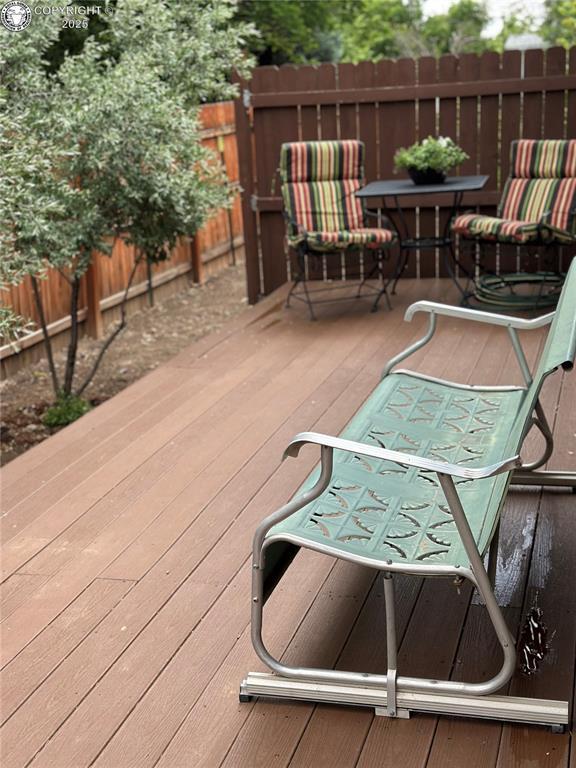 601 Petroleum Ave, Florence, CO 81226 - wooden deck featuring a fenced backyard and outdoor dining space