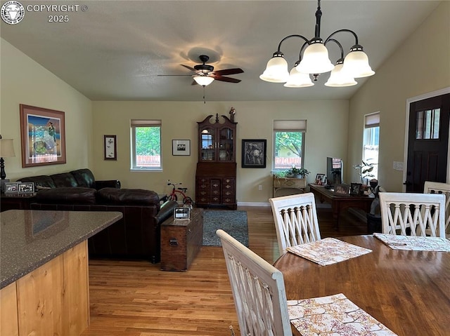 601 Petroleum Ave, Florence, CO 81226 - dining area featuring light wood finished floors, plenty of natural light, lofted ceiling, a ceiling fan, and a chandelier