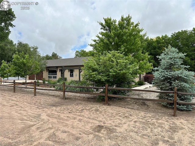 601 Petroleum Ave, Florence, CO 81226 - obstructed view of property with stucco siding