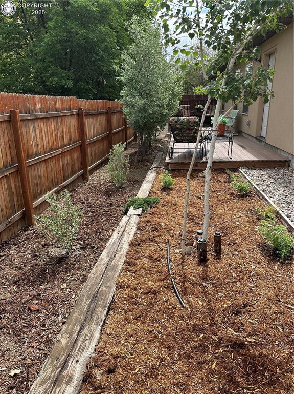 601 Petroleum Ave, Florence, CO 81226 - fenced backyard featuring a deck