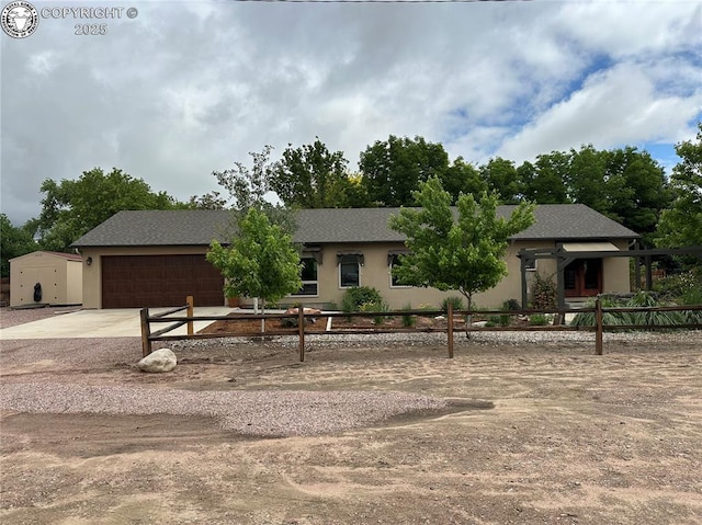 601 Petroleum Ave, Florence, CO 81226 - view of front of house featuring an attached garage, concrete driveway, and stucco siding