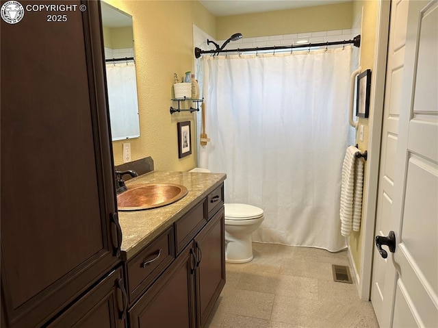 601 Petroleum Ave, Florence, CO 81226 - bathroom with vanity, toilet, tile patterned floors, curtained shower, and a textured wall