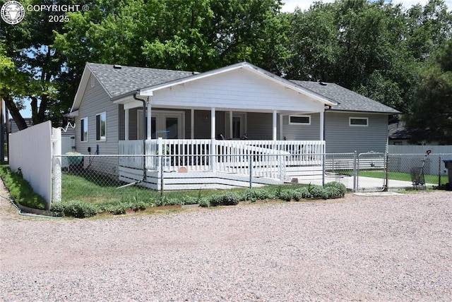 221 Greydene Ave, Canon City, CO 81212 - view of front of home with covered porch, a shingled roof, and a gate