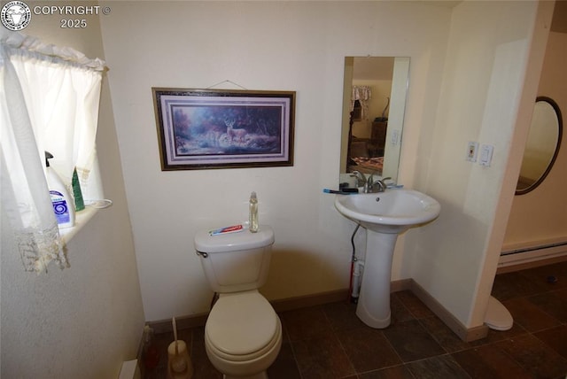 221 Greydene Ave, Canon City, CO 81212 - bathroom featuring a baseboard heating unit and tile patterned flooring