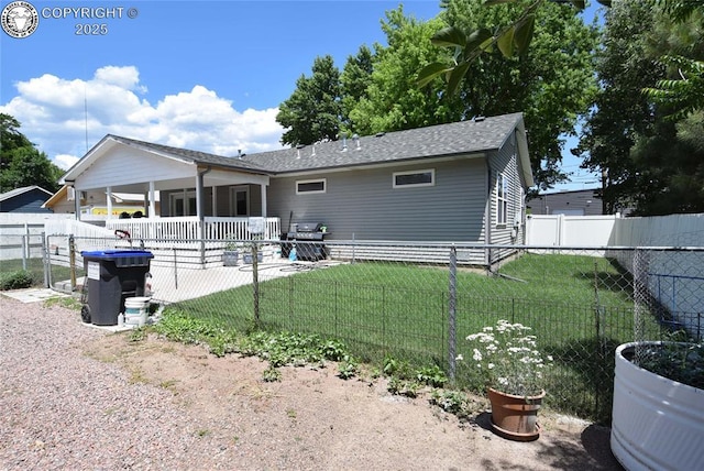 221 Greydene Ave, Canon City, CO 81212 - back of house featuring a fenced backyard, a patio, a shingled roof, and an attached carport