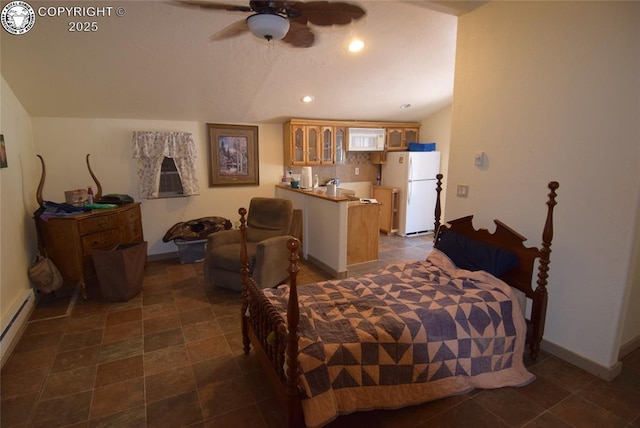 221 Greydene Ave, Canon City, CO 81212 - bedroom featuring freestanding refrigerator, recessed lighting, a baseboard radiator, and lofted ceiling