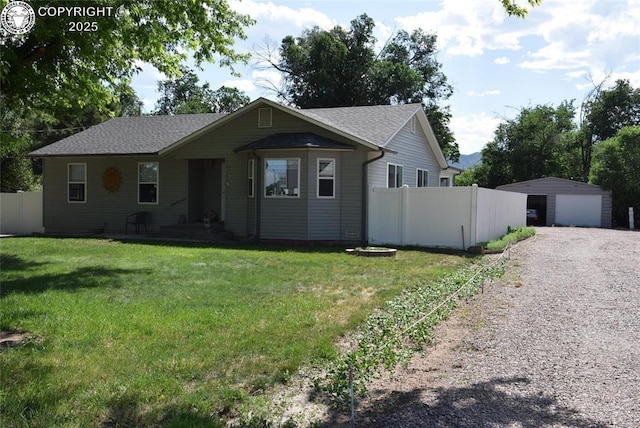 221 Greydene Ave, Canon City, CO 81212 - ranch-style house featuring a detached garage, an outdoor structure, and roof with shingles