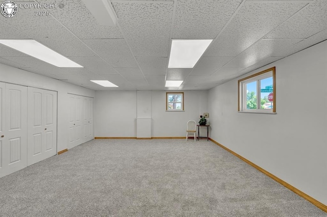 4401 Saint Clair Ave, Pueblo, CO 81005 - below grade area with carpet, baseboards, and a drop ceiling