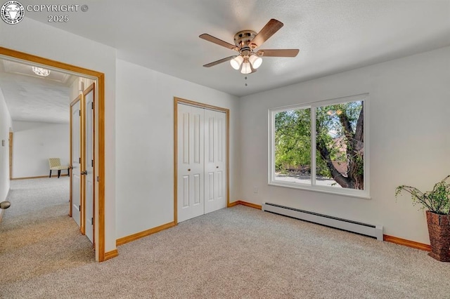 4401 Saint Clair Ave, Pueblo, CO 81005 - unfurnished bedroom with baseboard heating, carpet floors, and baseboards