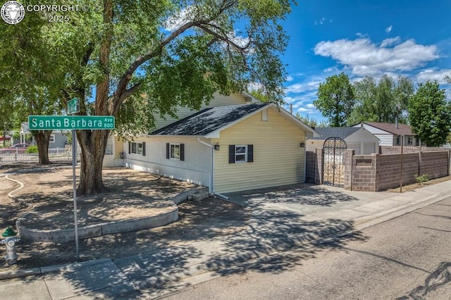 4401 Saint Clair Ave, Pueblo, CO 81005 - view of front of home with a gate and roof with shingles