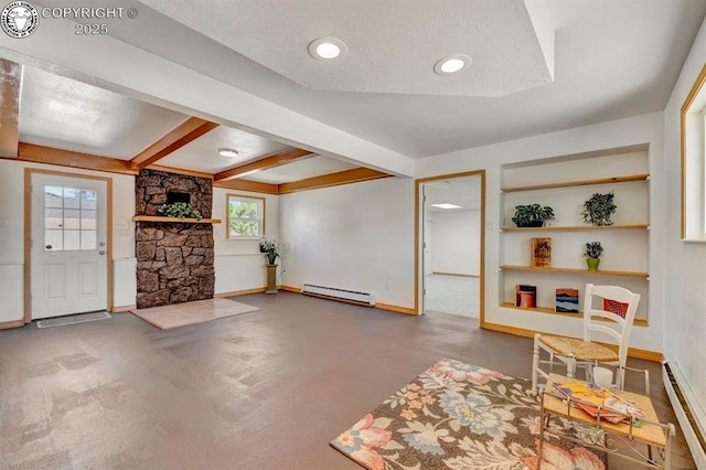 4401 Saint Clair Ave, Pueblo, CO 81005 - unfurnished living room with a baseboard heating unit, a stone fireplace, baseboards, a textured ceiling, and beamed ceiling