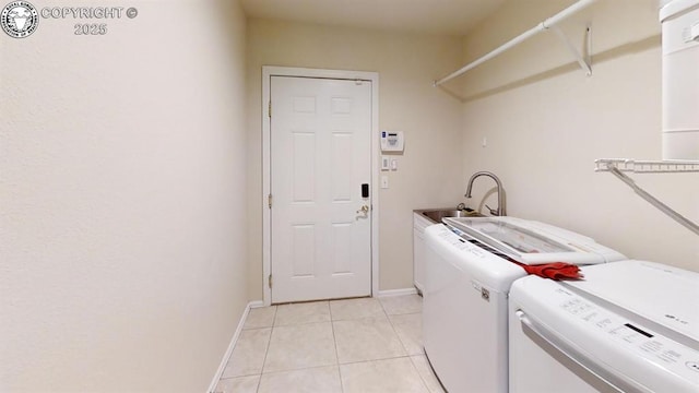 1018 S Camino De Bravo, Pueblo West, CO 81007 - laundry area with separate washer and dryer, light tile patterned flooring, and baseboards