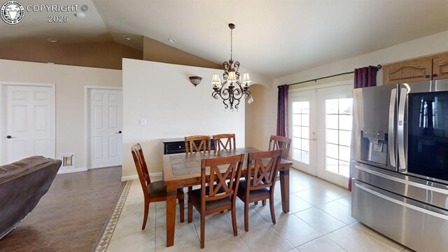 1018 S Camino De Bravo, Pueblo West, CO 81007 - dining space with lofted ceiling, a chandelier, light tile patterned flooring, and french doors