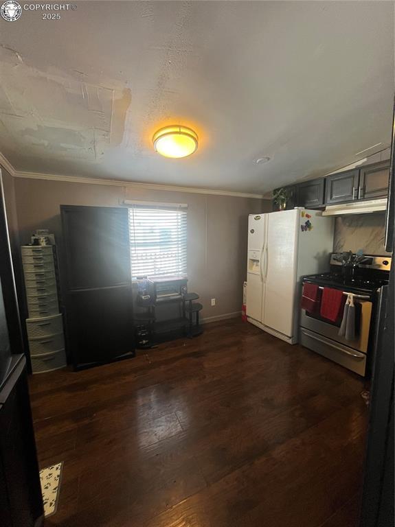 kitchen with gray cabinets, dark hardwood / wood-style floors, ornamental molding, white fridge with ice dispenser, and stainless steel range oven