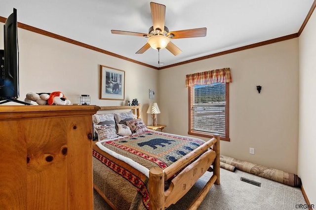 bedroom with ceiling fan, ornamental molding, and carpet