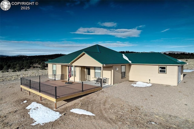 back of property with metal roof