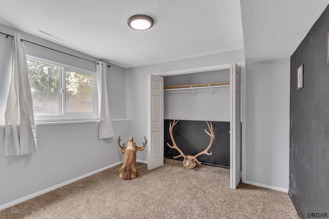 bedroom with carpet floors and a closet