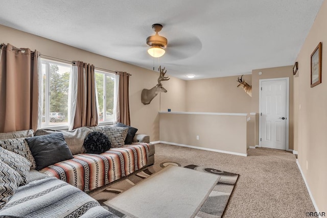 carpeted living room featuring ceiling fan