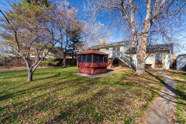 view of yard featuring a gazebo and a deck