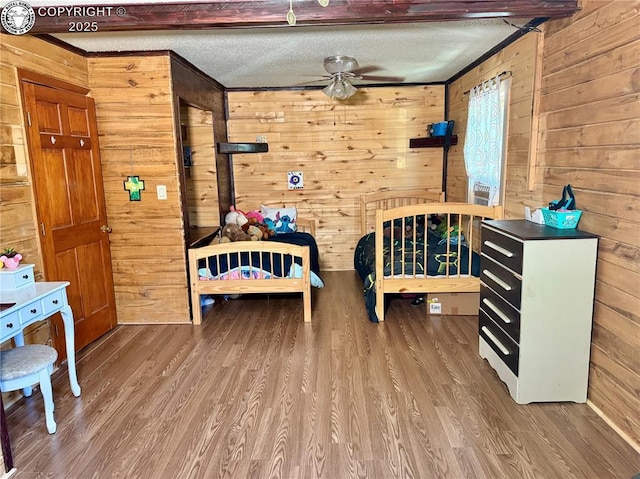 430 Broadway St, Silver Cliff, CO 81252 - bedroom featuring wood walls, wood finished floors, and crown molding
